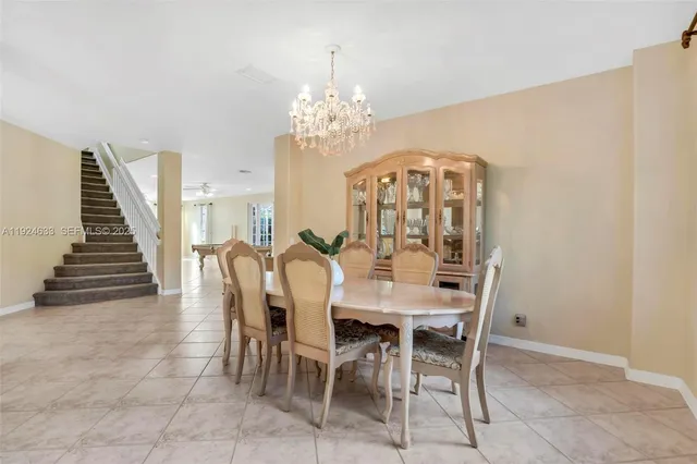 a kitchen with granite countertop a sink stove and cabinets
