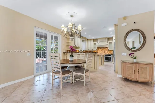 a kitchen with granite countertop a sink stove and cabinets
