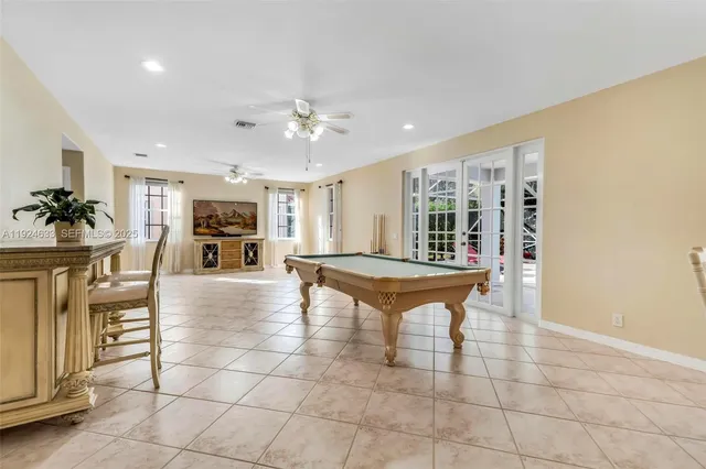 a kitchen with granite countertop a stove oven and sink