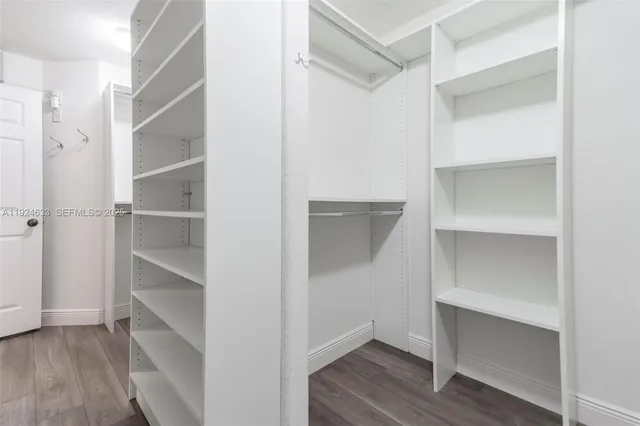 a bathroom with a double vanity sink a mirror and shower
