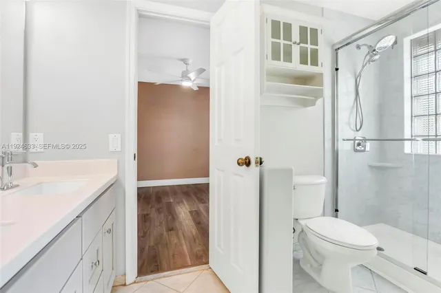 a bed room with a bed and a chair