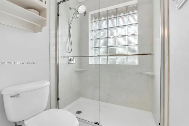 a view of a swimming pool with a table and chairs