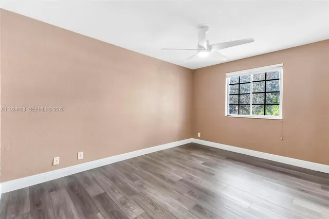 a view of a patio with a table and chairs