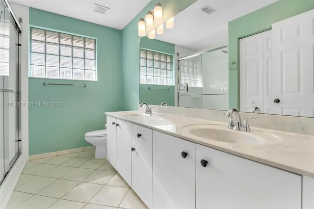 an aerial view of residential house with outdoor space and swimming pool