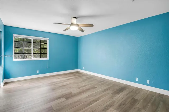 an aerial view of a house with a yard and garden