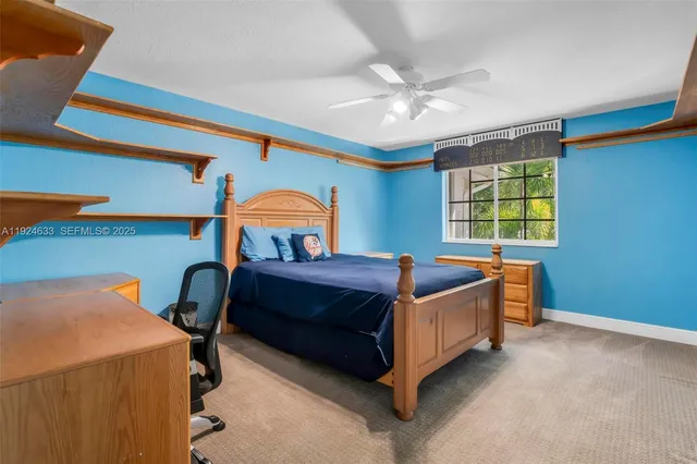 an aerial view of residential houses with outdoor space and swimming pool