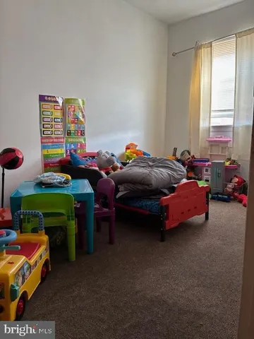 a bedroom with a bed and a table