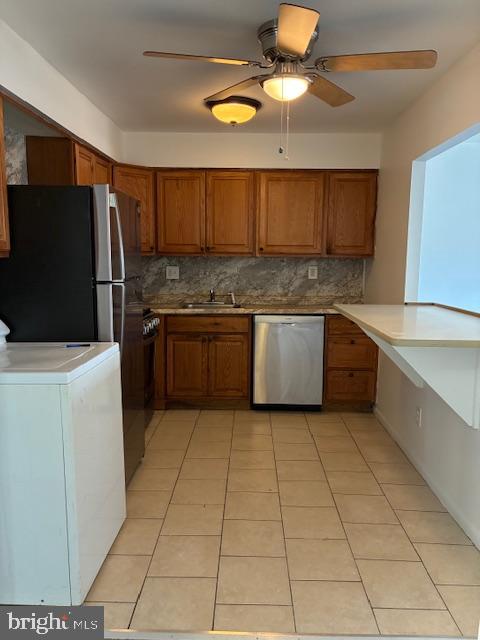 6805 Rutland Street Philadelphia, PA 19149 - Photo 6 of 23 a kitchen with stainless steel appliances granite countertop a sink and a refrigerator
