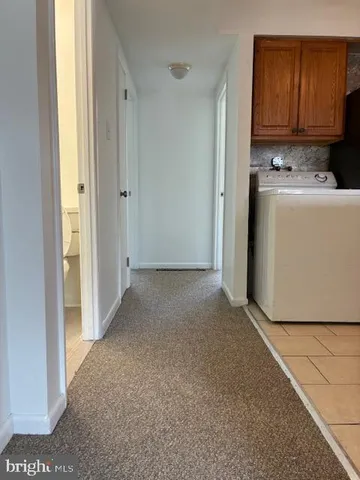 a view of a storage & utility room with washer and dryer