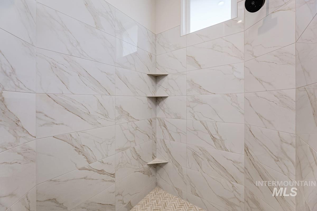 13424 North Spring Creek Way Boise, ID 83714 - Photo 18 of 43 Bathroom with a tile shower