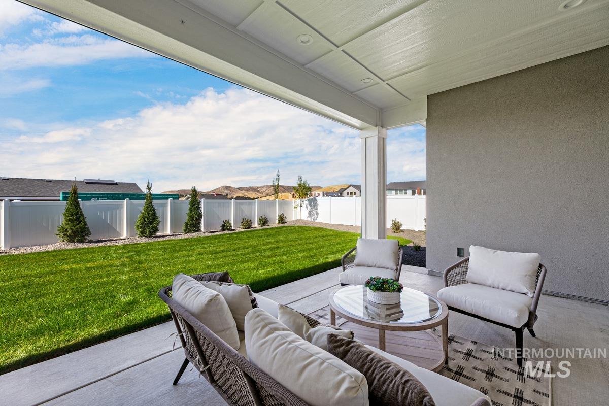 13424 North Spring Creek Way Boise, ID 83714 - Photo 30 of 43 Fenced backyard with outdoor furniture and a patio