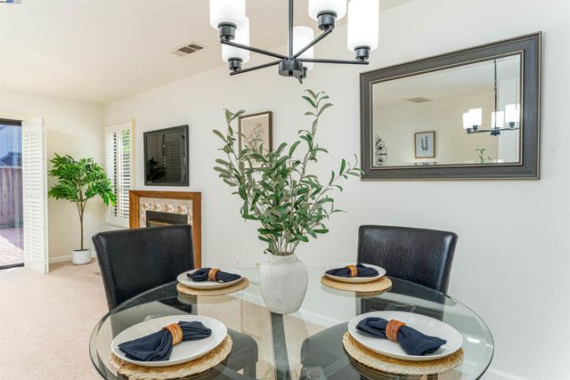 a kitchen with granite countertop a sink and a stove top oven