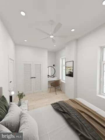 a bedroom with a bed and a couch