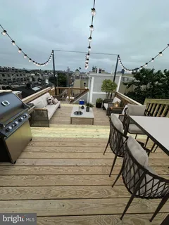 a outdoor patio with table and chairs