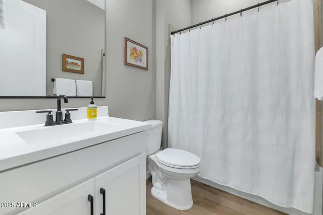 a bedroom with a bed and a table