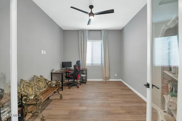 a workspace with furniture hardwood and a window