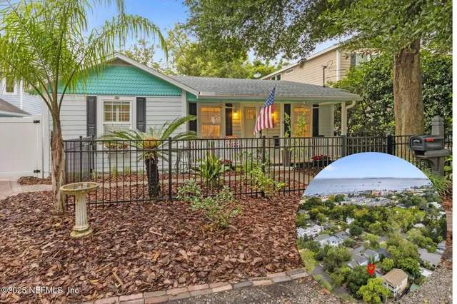 a view of a house with a small yard and plants