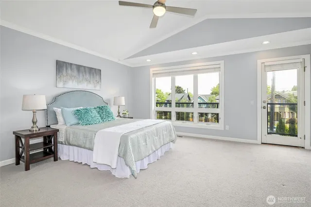 a spacious bedroom with a bed and a large window