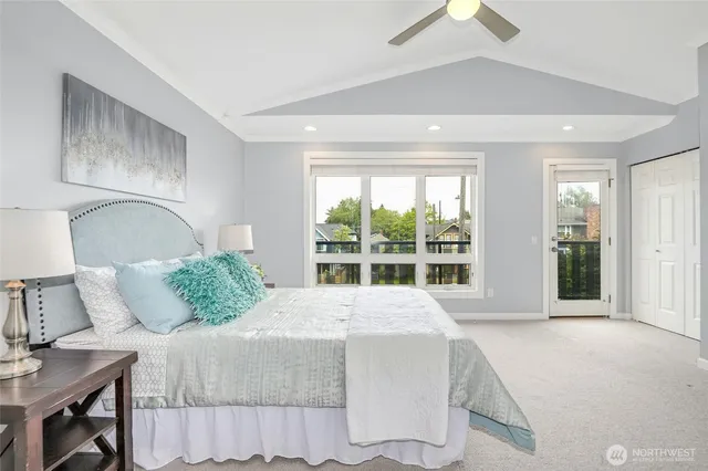 a bedroom with a large bed and a large window