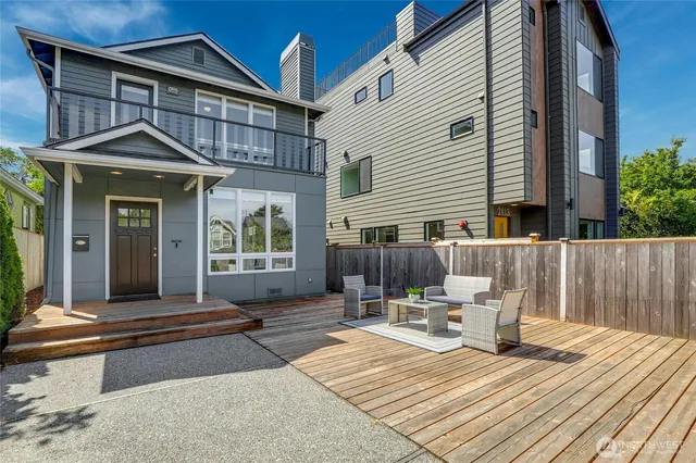 a front view of a house with a yard outdoor seating and barbeque oven