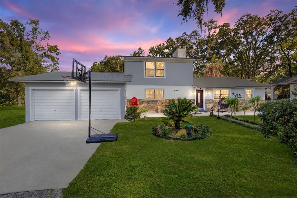 3003 East Fort King Street Ocala, FL 34470 - Photo 1 of 1 a front view of a house with a garden and plants