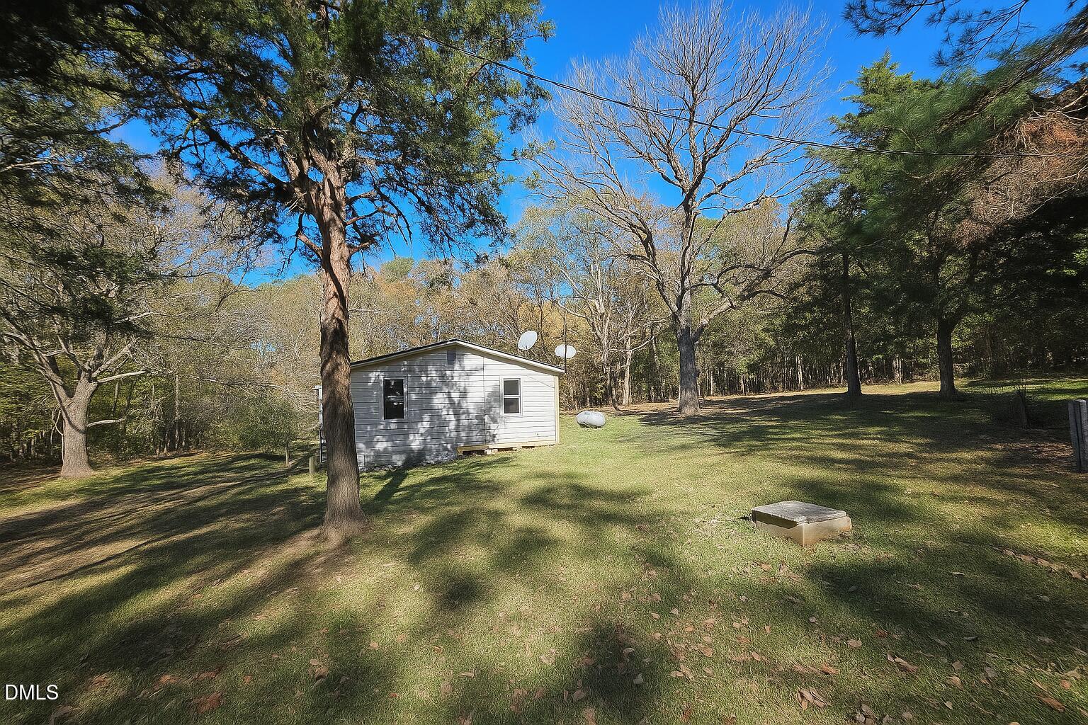 194 Jack Alston Road Pittsboro, NC 27312 - Photo 2 of 20 a view of a yard with a tree