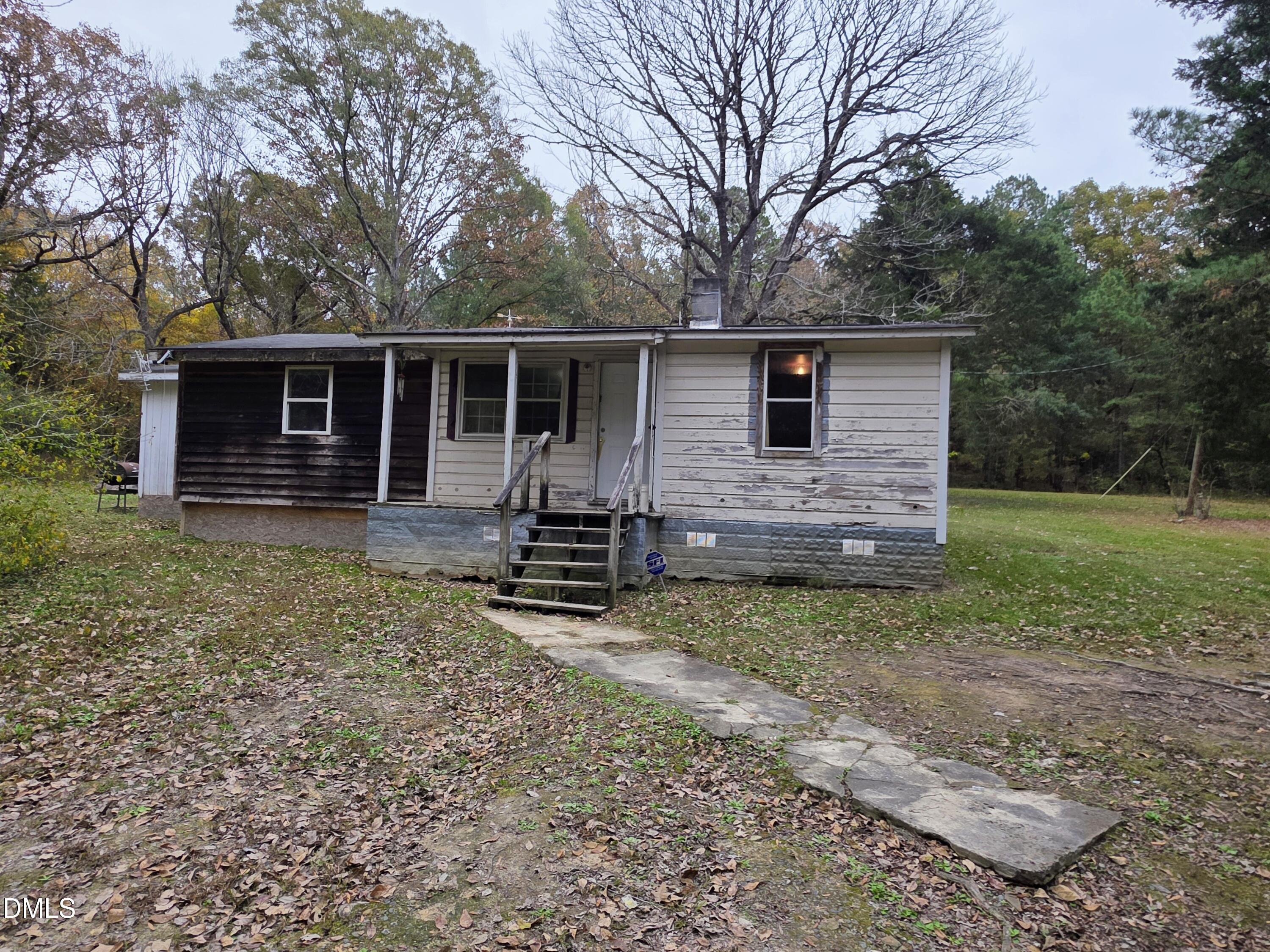 194 Jack Alston Road Pittsboro, NC 27312 - Photo 3 of 20 a view of a house with a yard and large tree