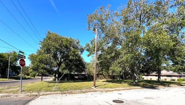a outdoor view of a building with traffic signal lights