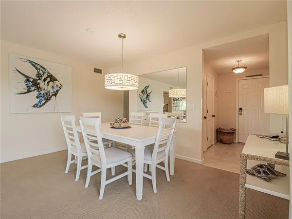 a view of a dining room with furniture