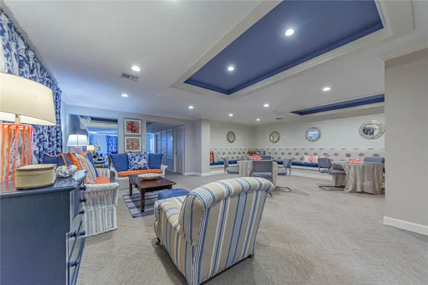 a living room with lots of furniture and a flat screen tv