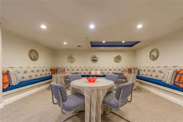 a dining room with furniture and wooden floor