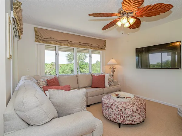 a living room with furniture and a window
