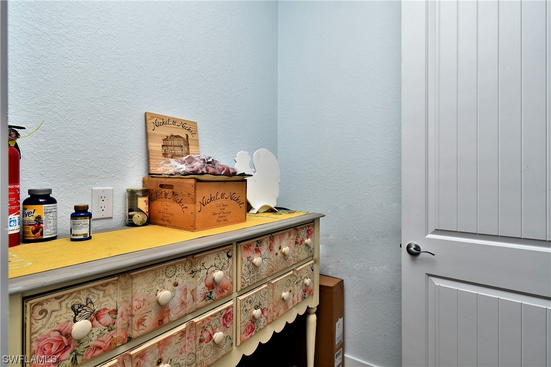 23170 North River Road Alva, FL 33920 - Photo 15 of 50 a bedroom with a bed and a window