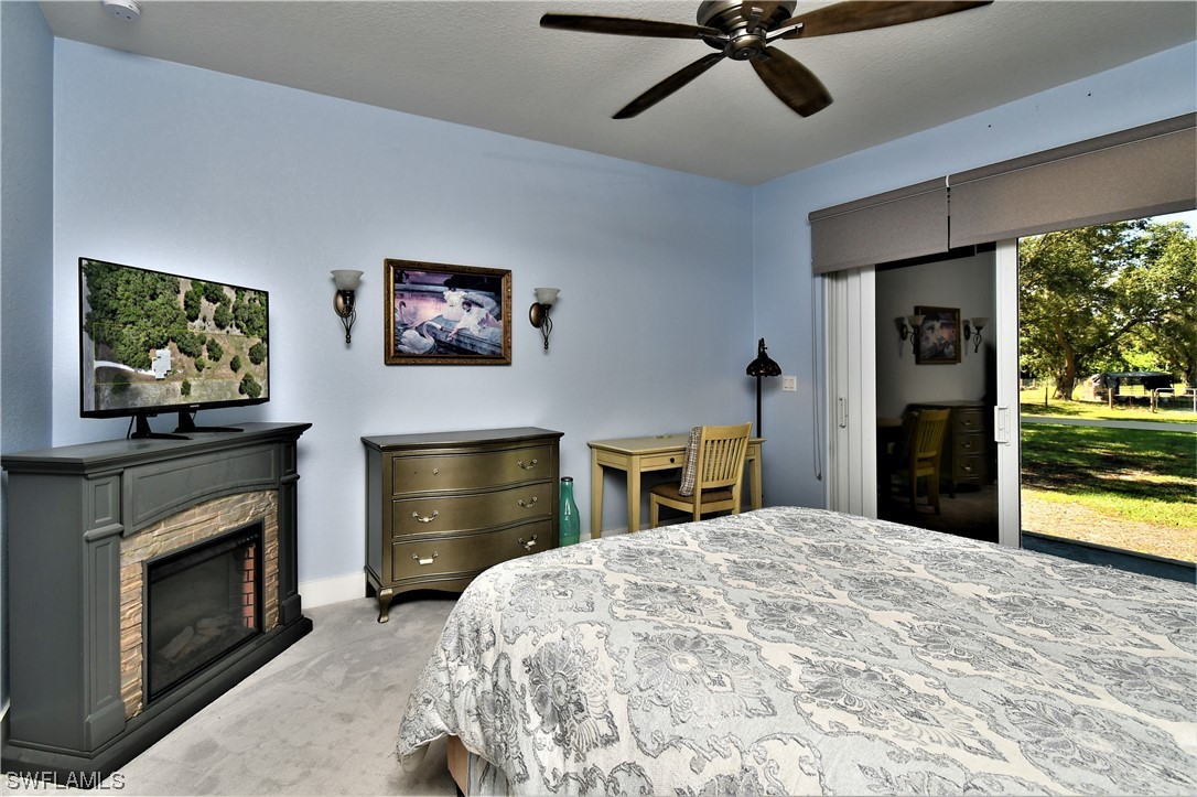23170 North River Road Alva, FL 33920 - Photo 16 of 50 a bed room with a bed and a television