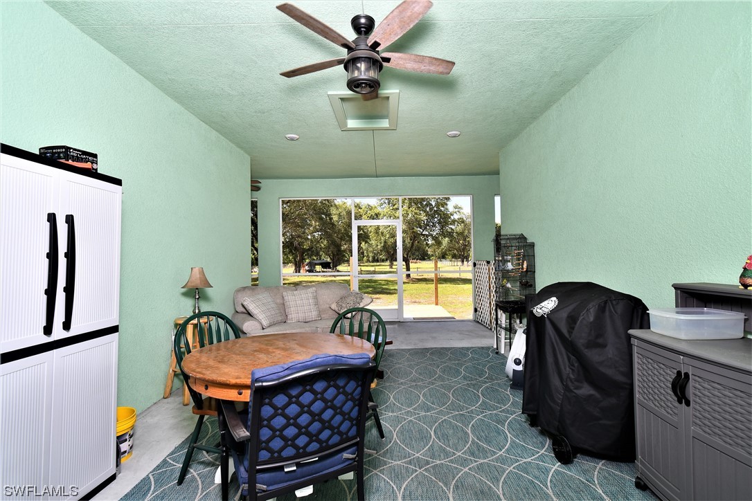 23170 North River Road Alva, FL 33920 - Photo 23 of 50 a living room with furniture and a large window