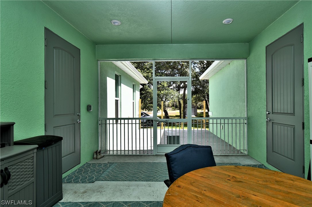 23170 North River Road Alva, FL 33920 - Photo 24 of 50 a bedroom with a bed and a window