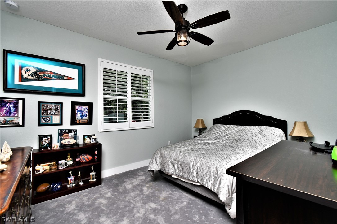 23170 North River Road Alva, FL 33920 - Photo 28 of 50 a bedroom with a bed and window