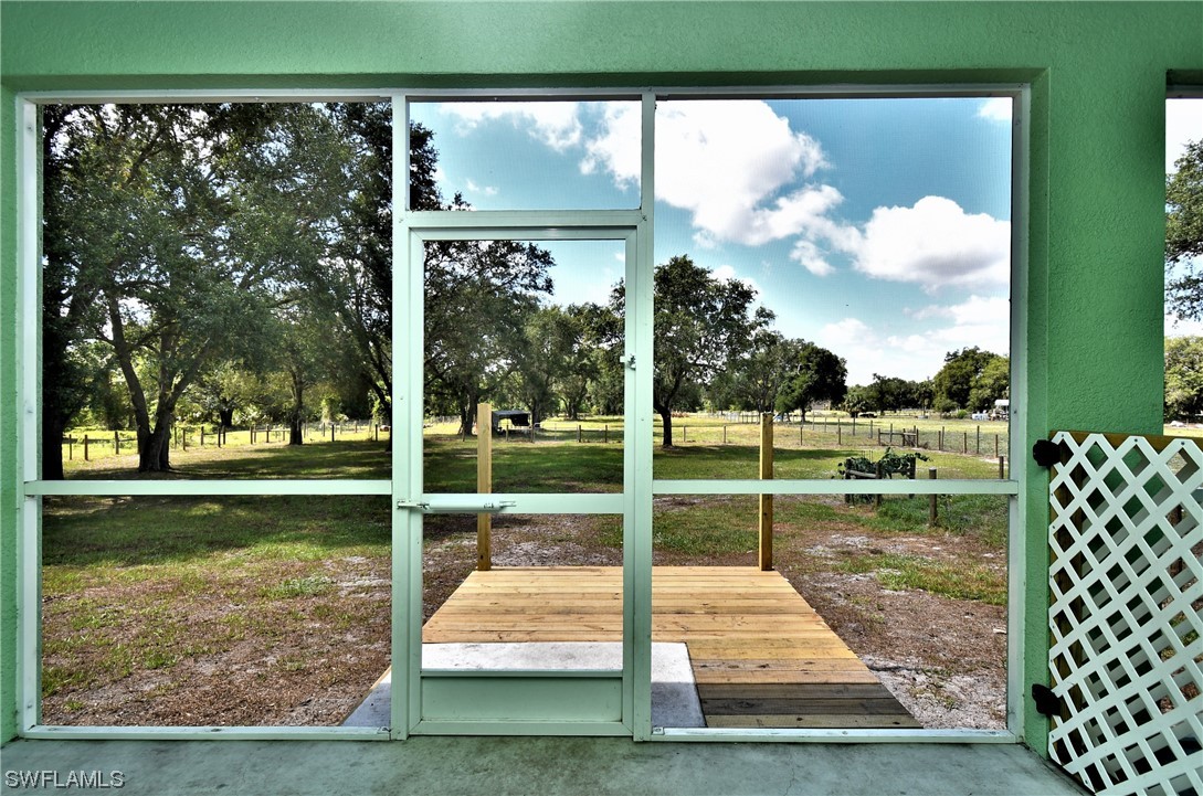 23170 North River Road Alva, FL 33920 - Photo 31 of 50 a view of a garden and lake