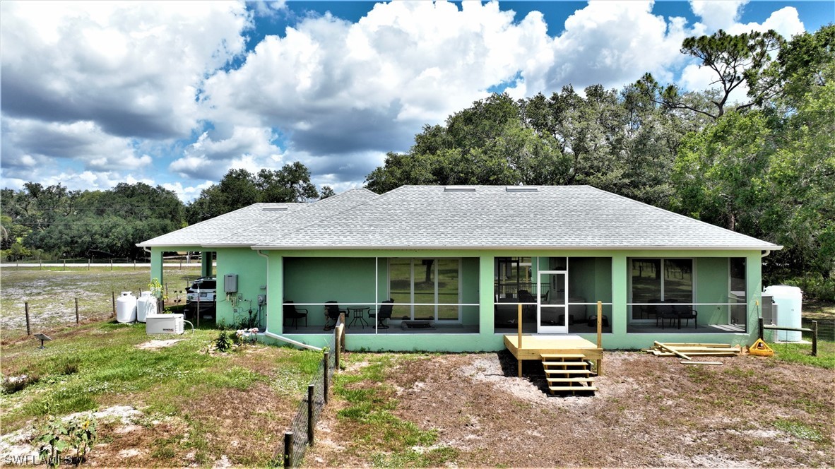 23170 North River Road Alva, FL 33920 - Photo 33 of 50 a house view with a garden space