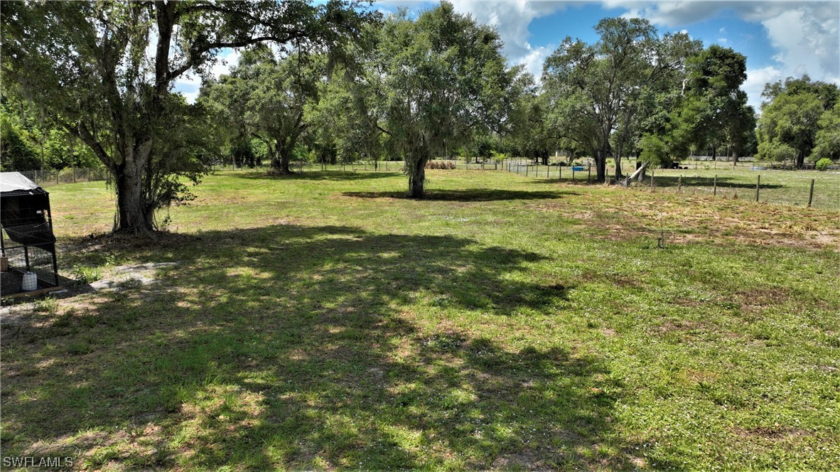 23170 North River Road Alva, FL 33920 - Photo 35 of 50 a view of outdoor space with trees all around