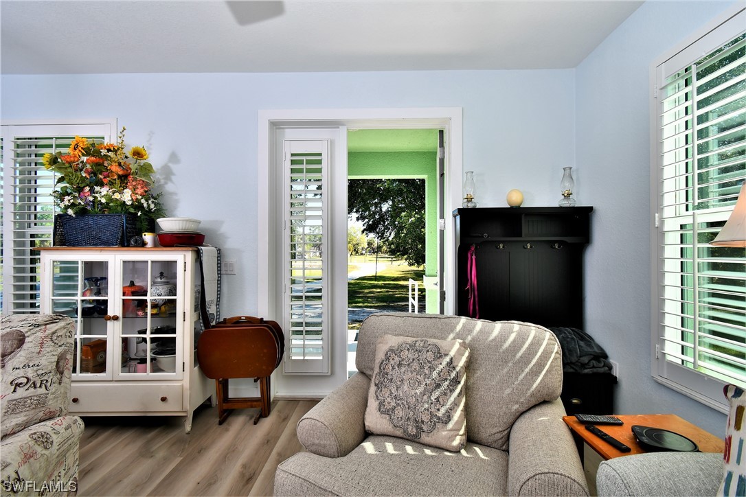 23170 North River Road Alva, FL 33920 - Photo 5 of 50 a living room with furniture flowerpot and wooden floor