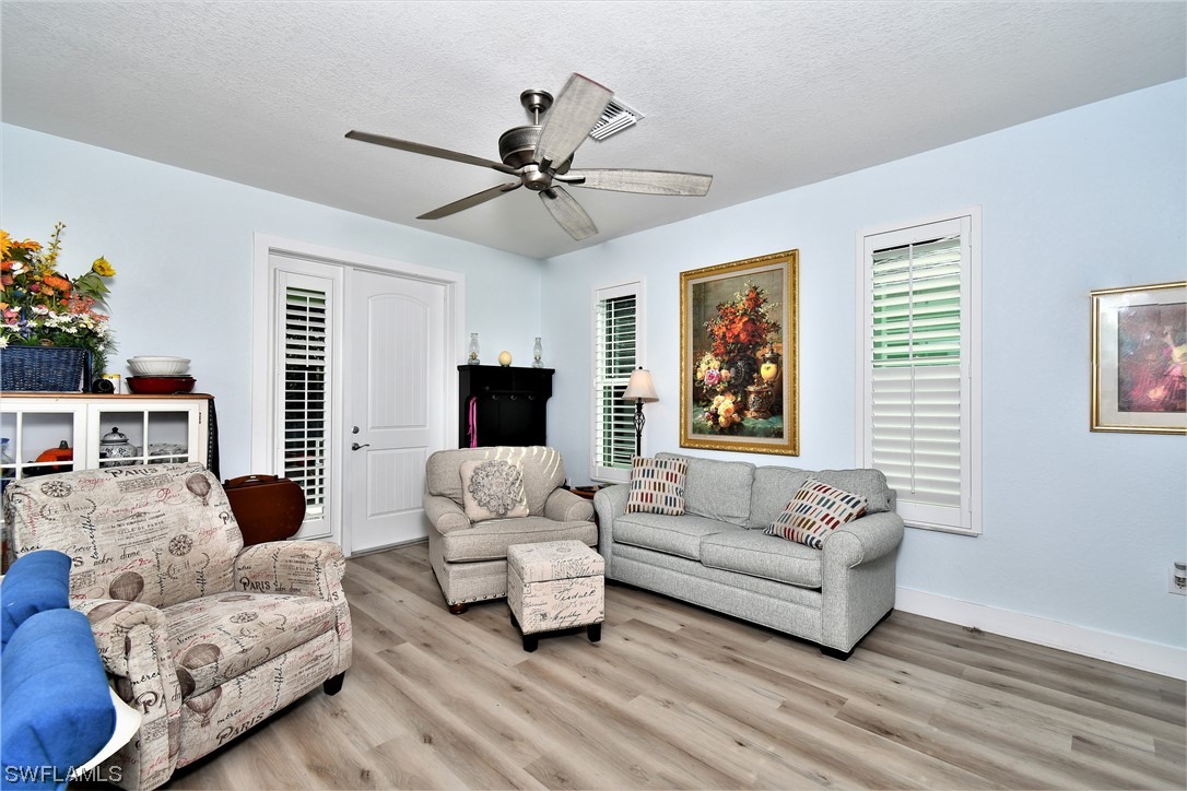 23170 North River Road Alva, FL 33920 - Photo 6 of 50 a living room with furniture and a large window
