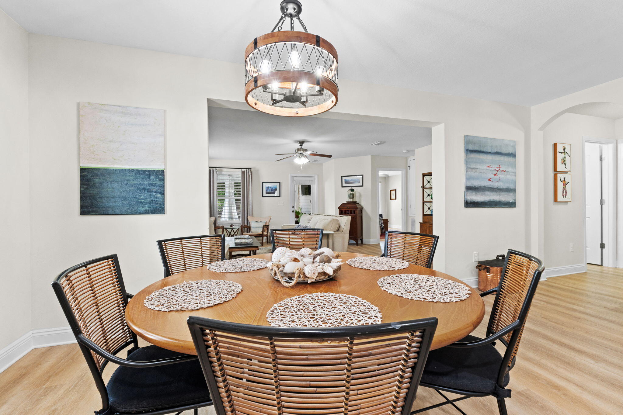 587 Fanny Ann Way Freeport, FL 32439 - Photo 11 of 78 a view of a dining room with furniture a chandelier and wooden floor