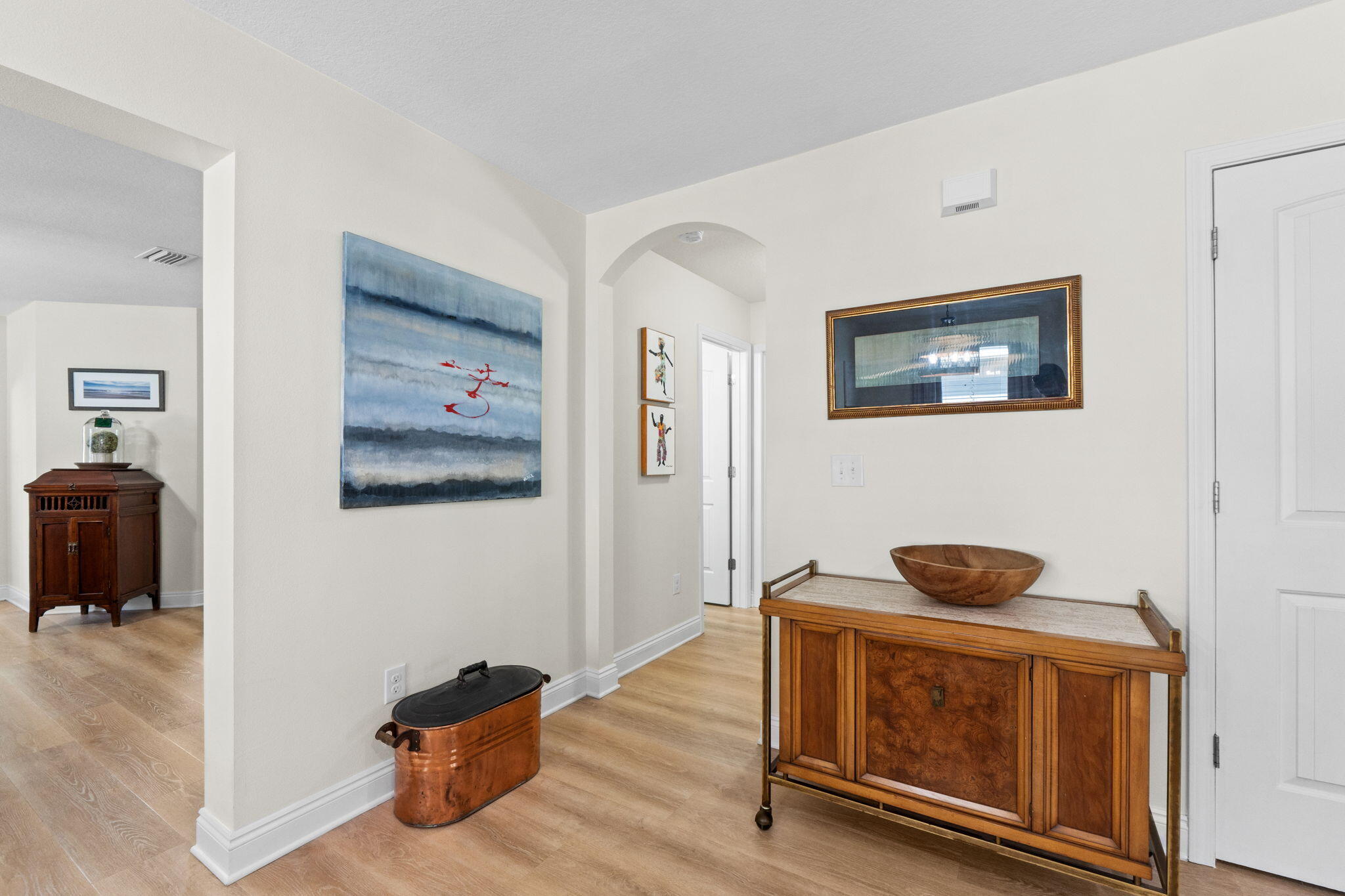 587 Fanny Ann Way Freeport, FL 32439 - Photo 12 of 78 a hallway with front door and wooden floor
