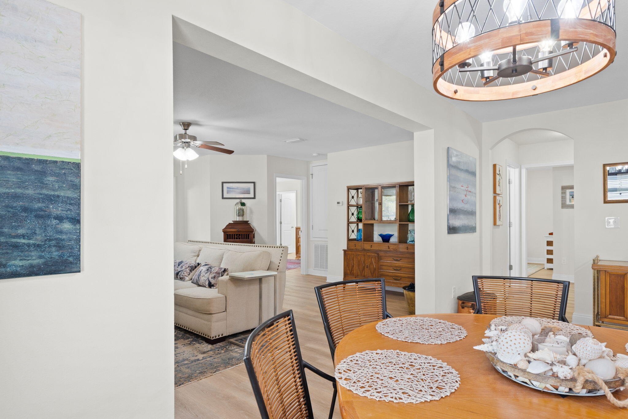 587 Fanny Ann Way Freeport, FL 32439 - Photo 13 of 78 a living room with furniture potted plant and a chandelier