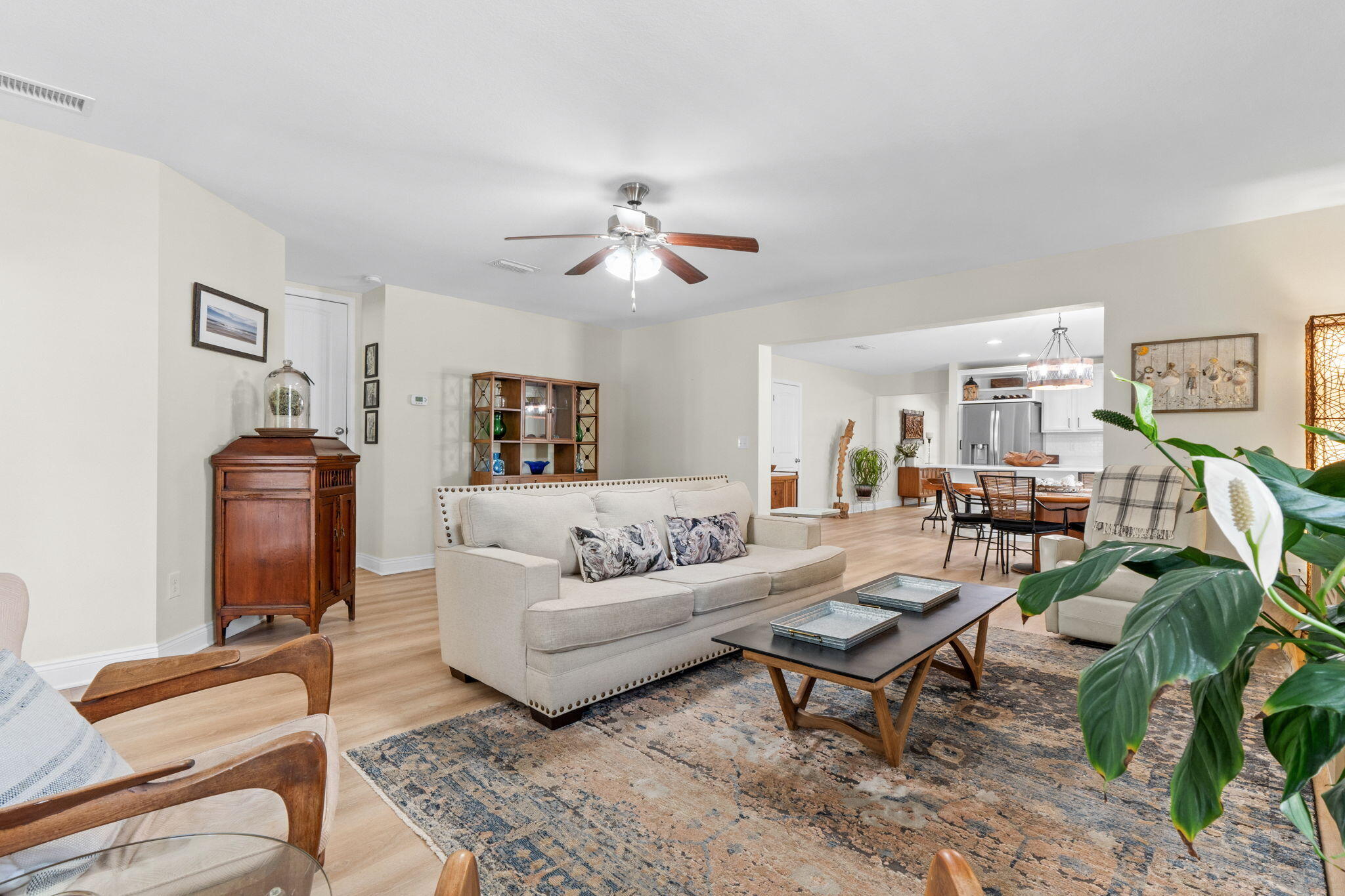 587 Fanny Ann Way Freeport, FL 32439 - Photo 19 of 78 a living room with furniture a chandelier and a rug