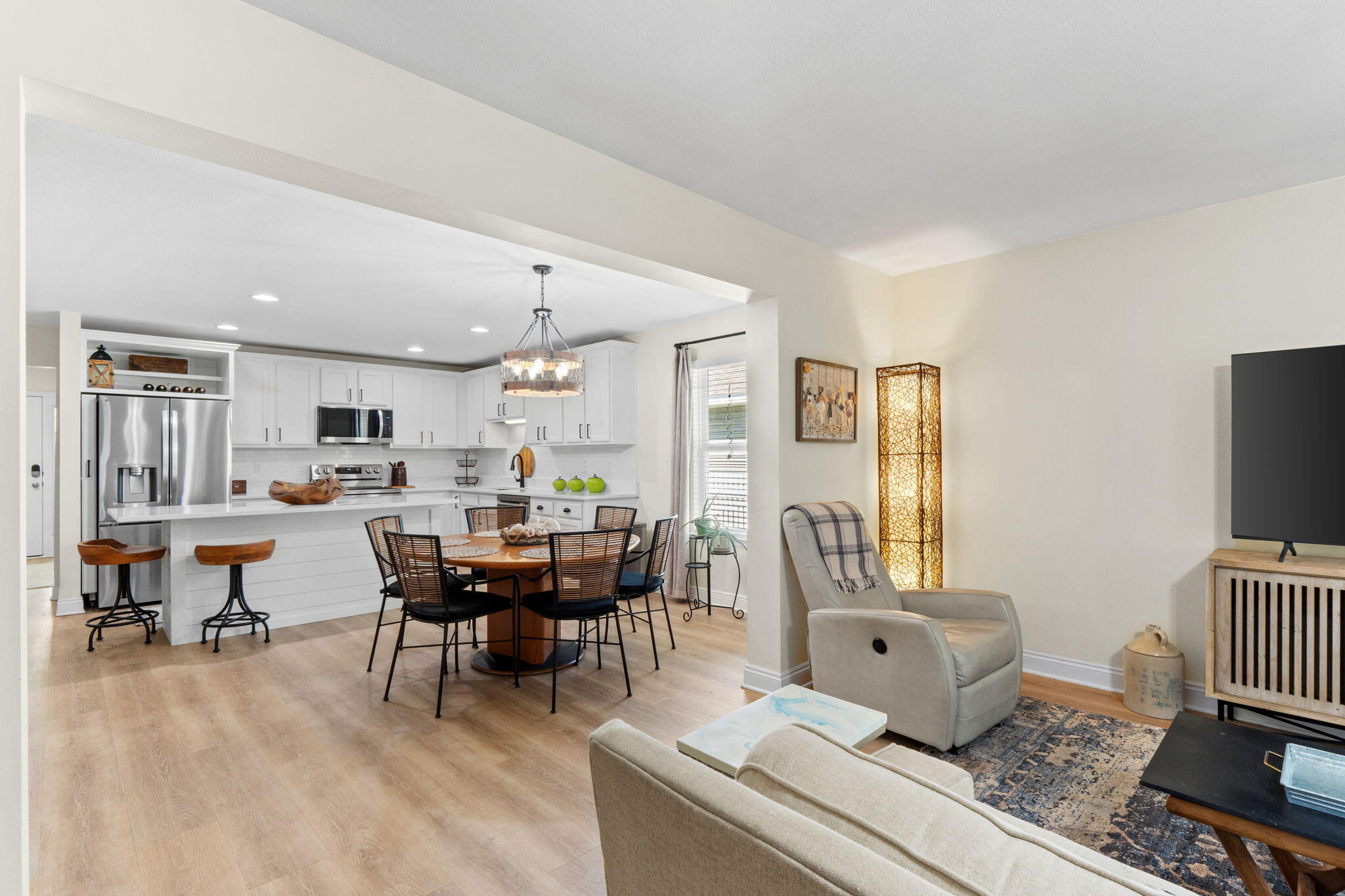 587 Fanny Ann Way Freeport, FL 32439 - Photo 20 of 78 a living room with furniture and a dining table with kitchen view