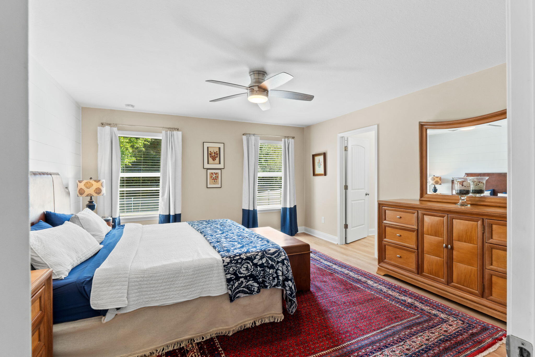 587 Fanny Ann Way Freeport, FL 32439 - Photo 22 of 78 a bedroom with a bed and wooden floor