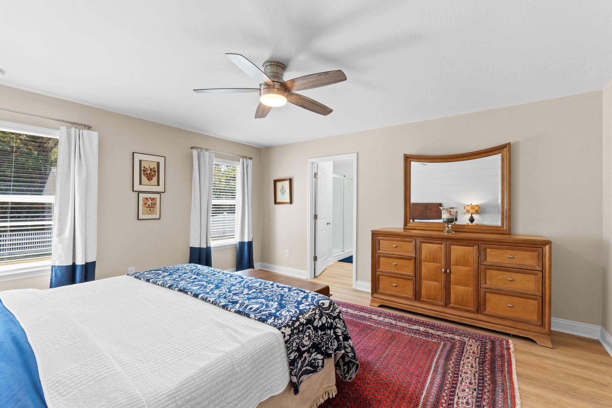 587 Fanny Ann Way Freeport, FL 32439 - Photo 23 of 78 a bedroom with a bed and wooden floor