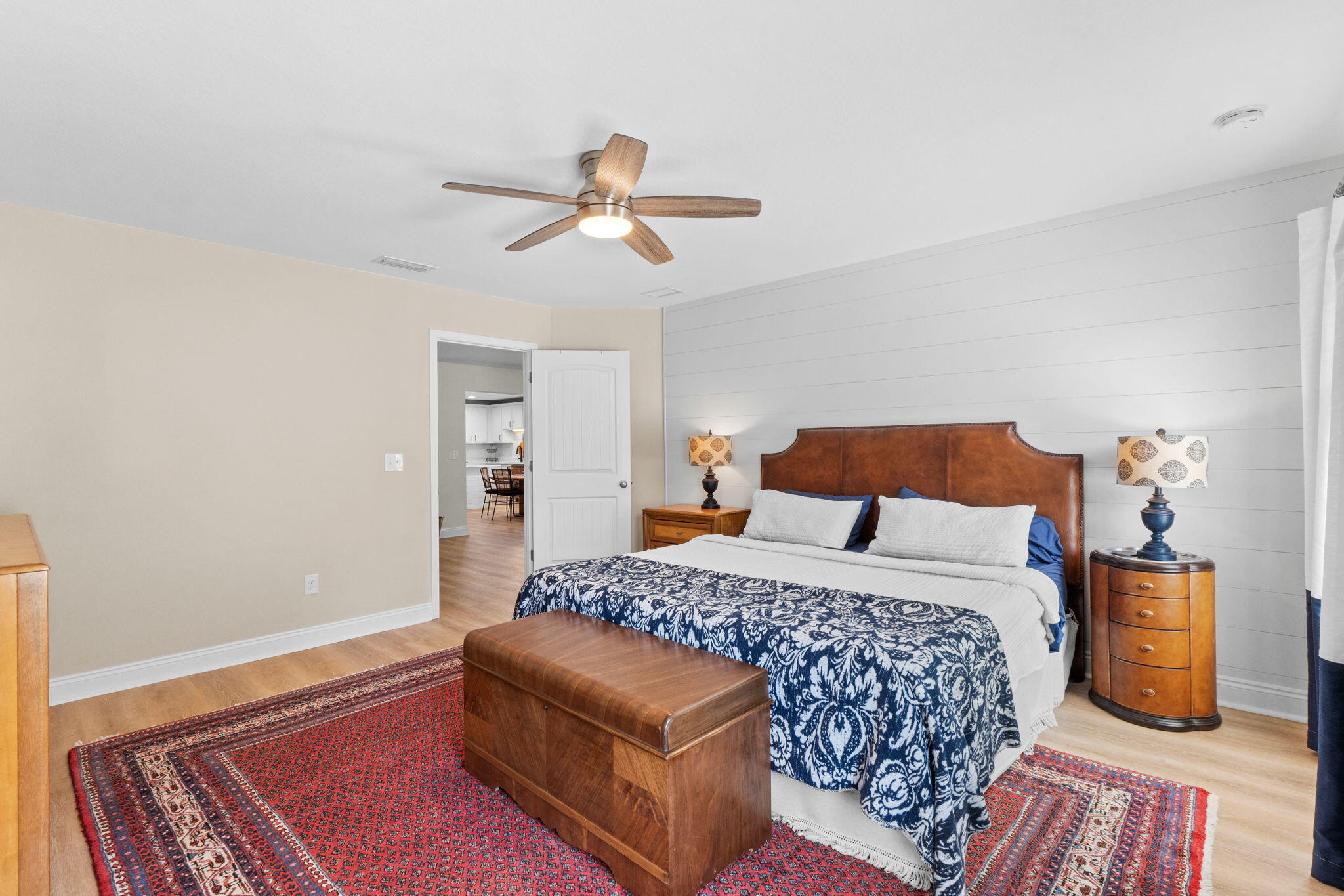 587 Fanny Ann Way Freeport, FL 32439 - Photo 24 of 78 a bedroom with a bed and wooden floor